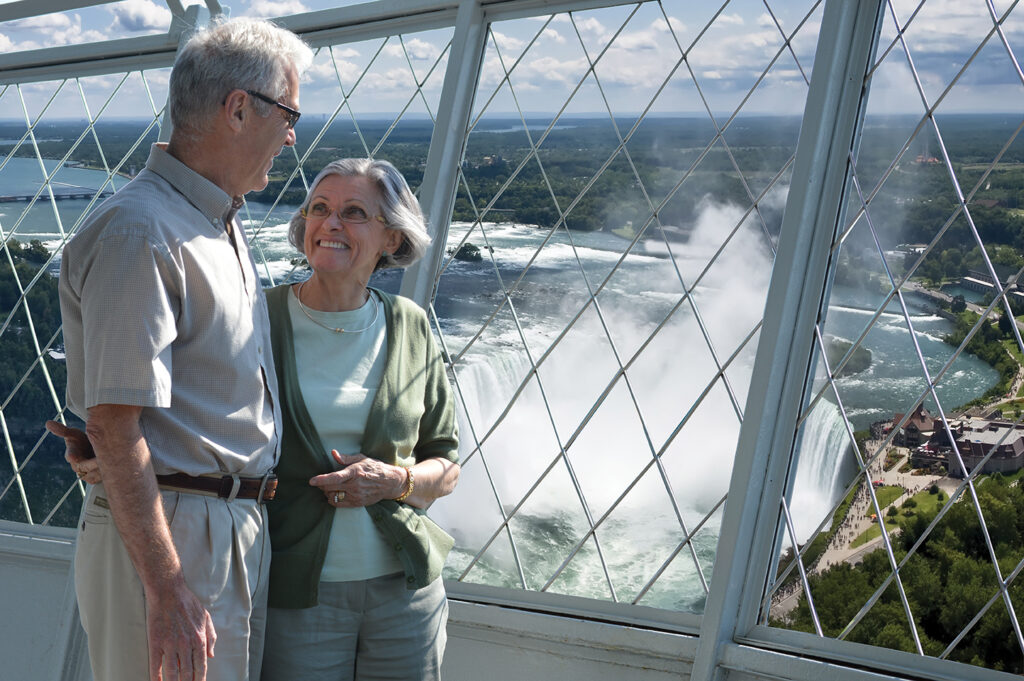 two seniors overlooking niagara falls from skylon tower